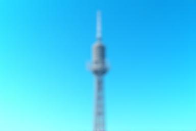 Mobile network tower against a blue sky